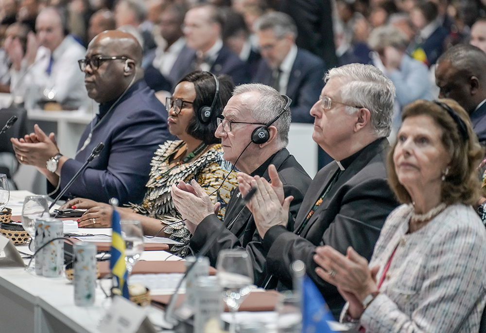Cardinal Pietro Parolin, center, applauds a speaker during the opening session of the leaders' summit of COP30, the U.N. Climate Change Conference, in Belém, Brazil, Nov. 6. (CNS photo/COP30/Rafa Neddermeyer)
