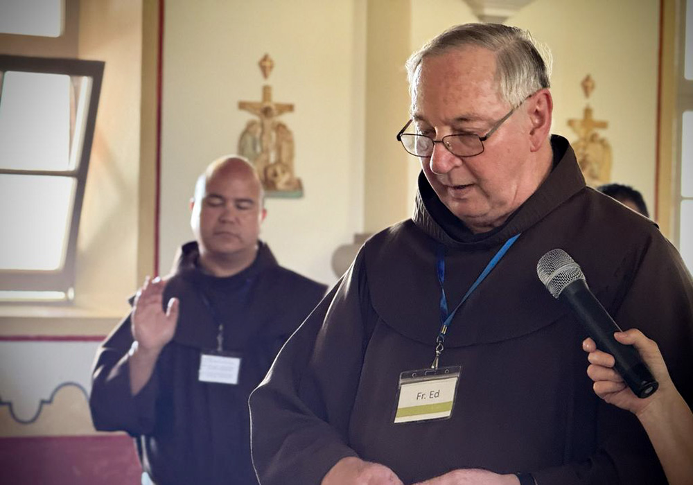 Franciscan Fr. Ed McKenzie leads a ritual during the Veterans Retreat at Mission San Luis Rey in Oceanside, California. In the background is Fanciscan Fr. Roger Lopez. (Jen Jauregui)