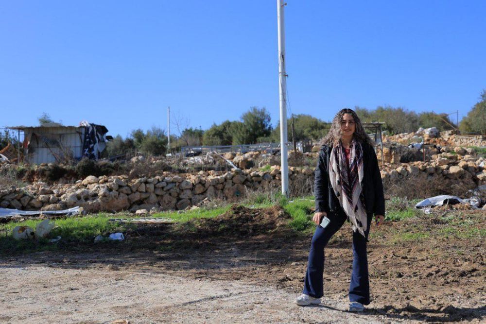 Alice Kisiya stands on her family farm in Palestine in December 2025 after the Israeli Supreme Court returned the family's land. The Kisiyas are among a minority of Christians who have lived in the Al-Makhrour valley for thousands of years and make up about 1% of the West Bank's population. (Courtesy of Alice Kisiya)