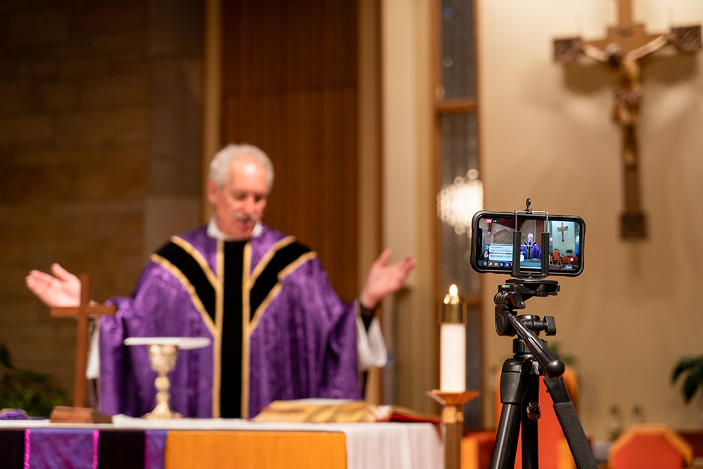 Mass is livestreamed on Facebook at St. Charles Borromeo Catholic Church in Bloomington, Ind., March 24, 2020, during the COVID-19 pandemic. (CNS/Katie Rutter)