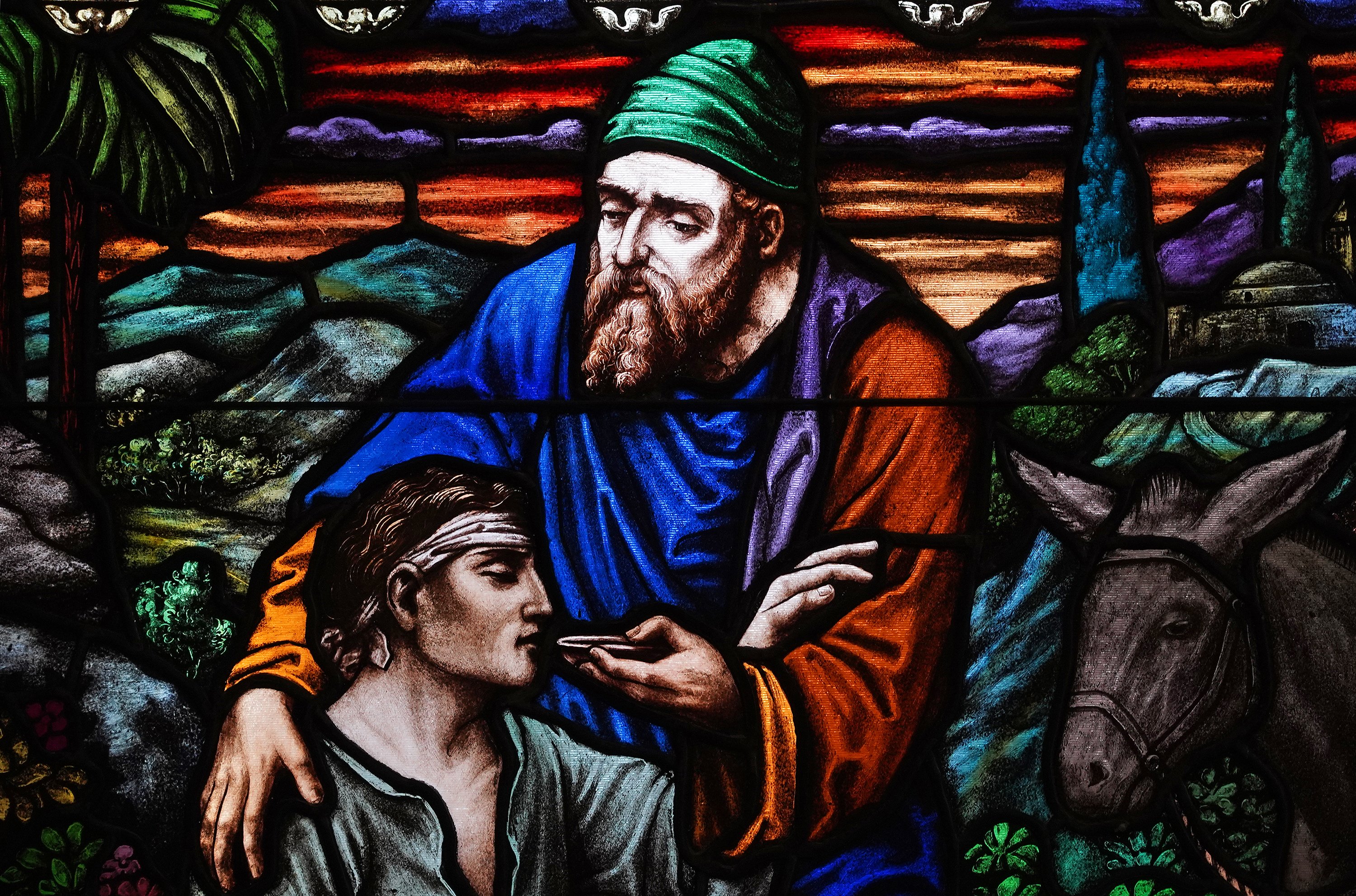 The parable of the good Samaritan is depicted in a stained-glass window at Good Samaritan Hospital Medical Center in West Islip, New York, on World Day of the Sick, Feb. 11, 2021. (CNS/Gregory A. Shemitz)