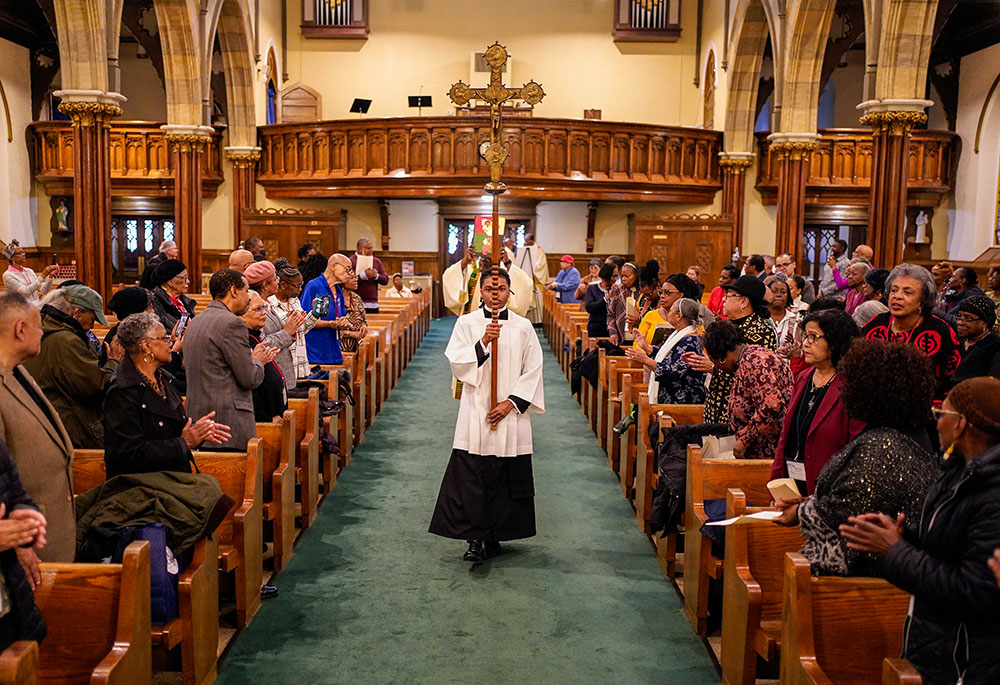 An altar server leads the opening procession during Mass at the inaugural New York Black Catholic Congress at Blessed Sacrament Church in New Rochelle, N.Y., Nov. 22, 2025. (OSV News/Gregory A. Shemitz)