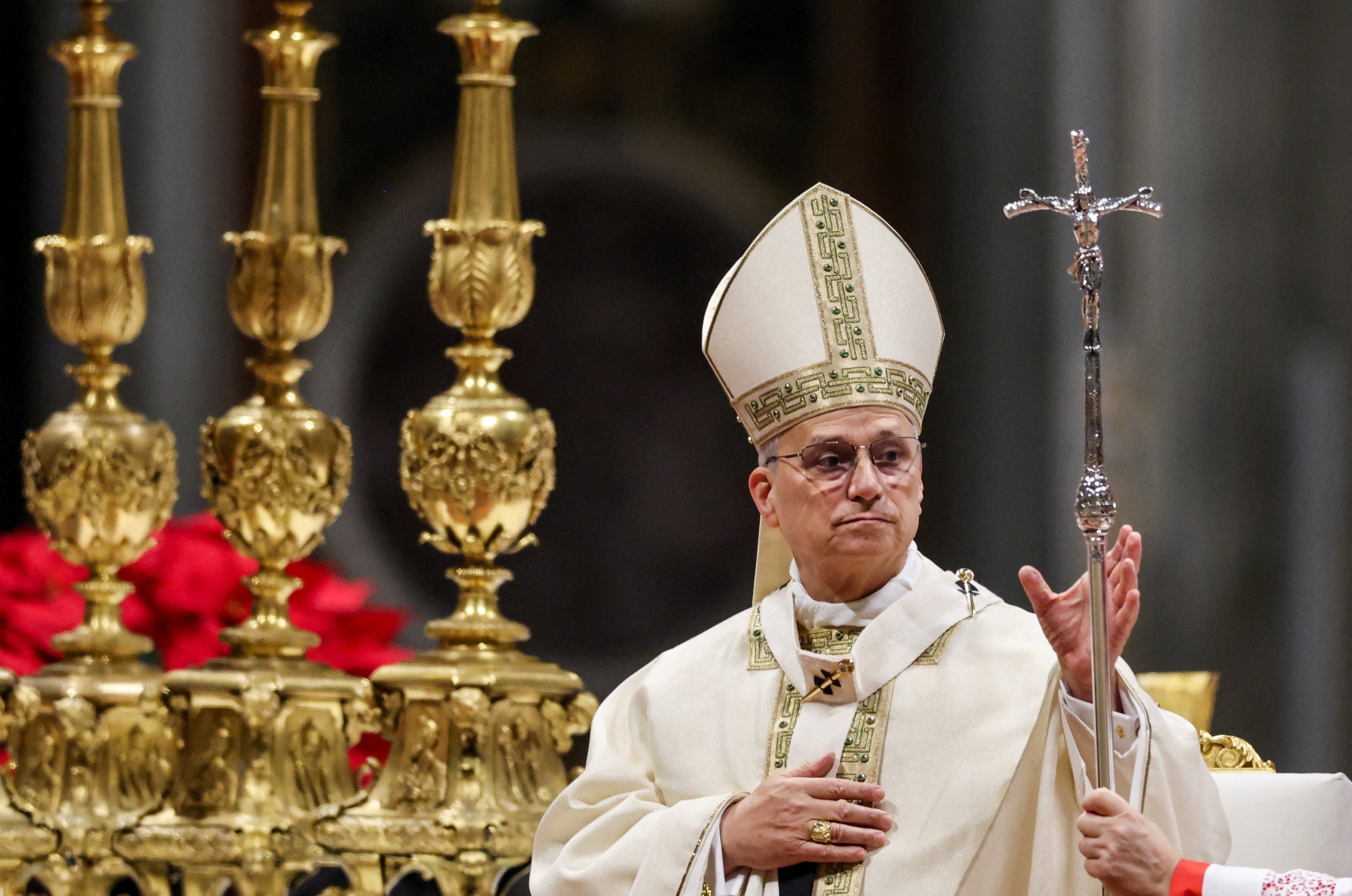 Pope Leo XIV is handed his crosier as he celebrates Mass on the feast of the Epiphany in St. Peter's Basilica at the Vatican Jan. 6, 2026. (OSV News photo/Yara Nardi, Reuters)
