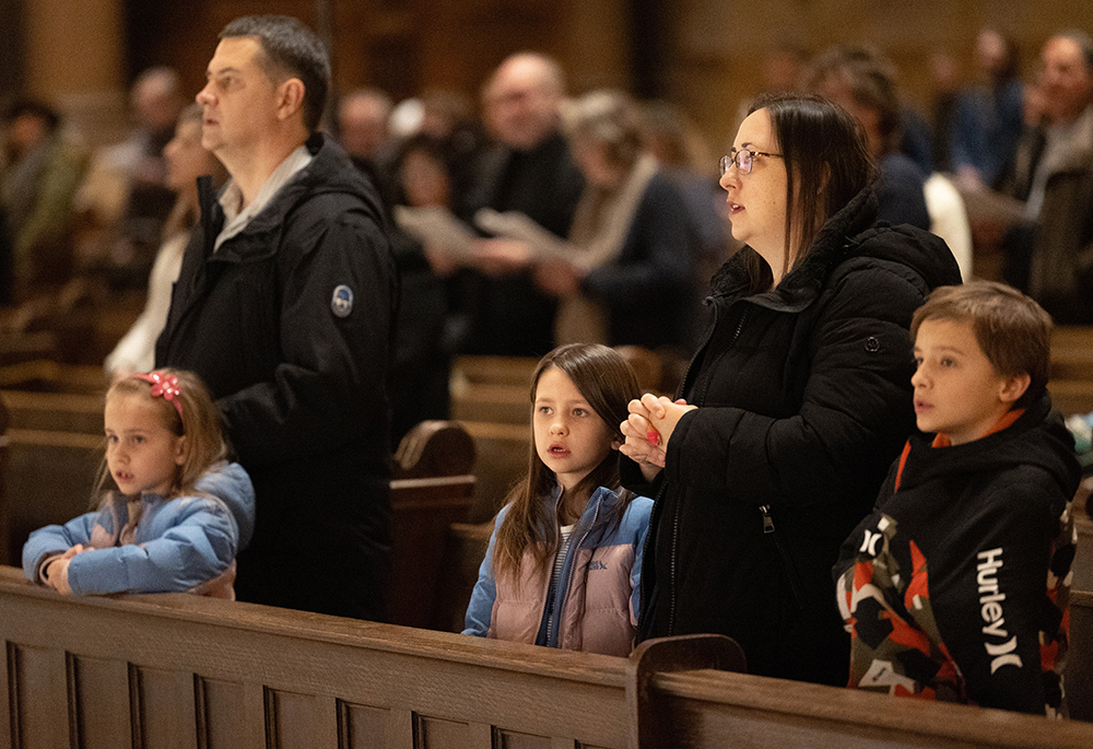 A family prays as Archbishop Bernard A. Hebda of St. Paul and Minneapolis celebrates an evening Mass for peace Jan. 25, 2026, at the Cathedral of St. Paul in St. Paul. Hebda celebrated the Mass following the Jan. 24 shooting death of Alex Pretti, a 37-year-old intensive care nurse who was shot during an incident with federal agents in south Minneapolis. (OSV News/The Catholic Spirit/Dave Hrbacek)
