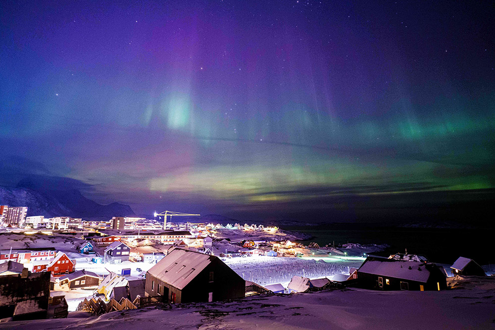 Aurora borealis, also known as the northern lights, is seen in the sky above Nuuk, Greenland, Jan. 20, 2026. (AP/Evgeniy Maloletka)
