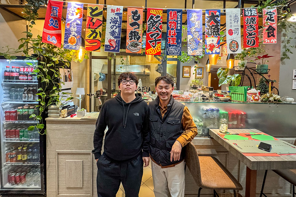 Kungfu Express owner LinNing Tang and his son Kevin in the restaurant in Rome. In the year leading up to his election to the papacy, Cardinal Robert Prevost — now Pope Leo XIV — would stop at Kungfu Express for his go-to meal. (Kielce Gussie)
