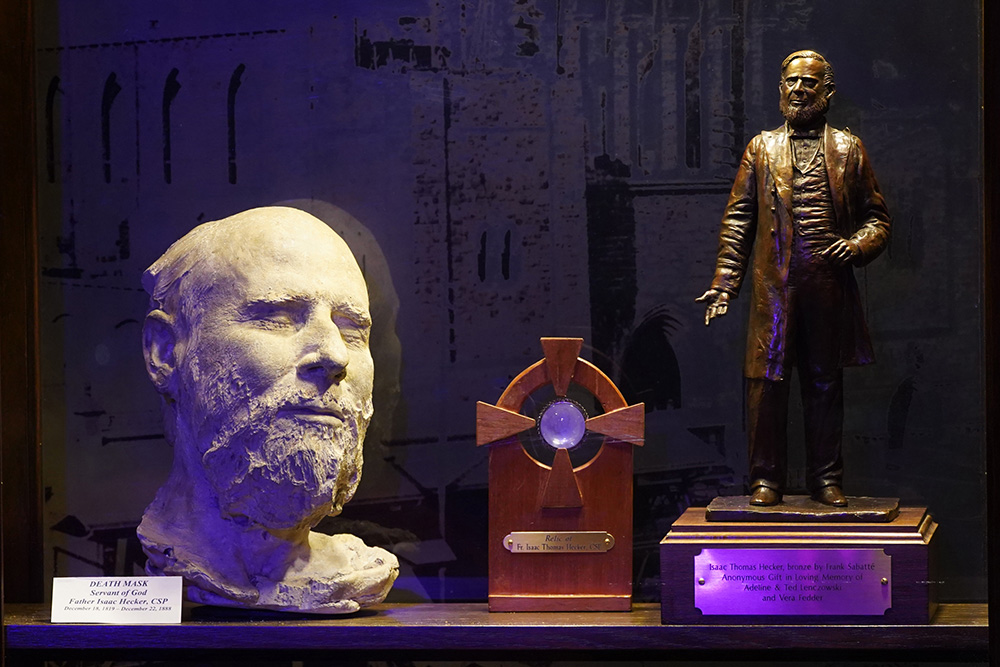 A death mask, relic and statue of Fr. Isaac Hecker are seen in a display case at St. Paul the Apostle Church in New York City on the 200th anniversary of his birth, Dec. 18, 2019. Hecker, who founded the Paulist Fathers in 1858, is entombed in the church. (CNS/Gregory A. Shemitz)