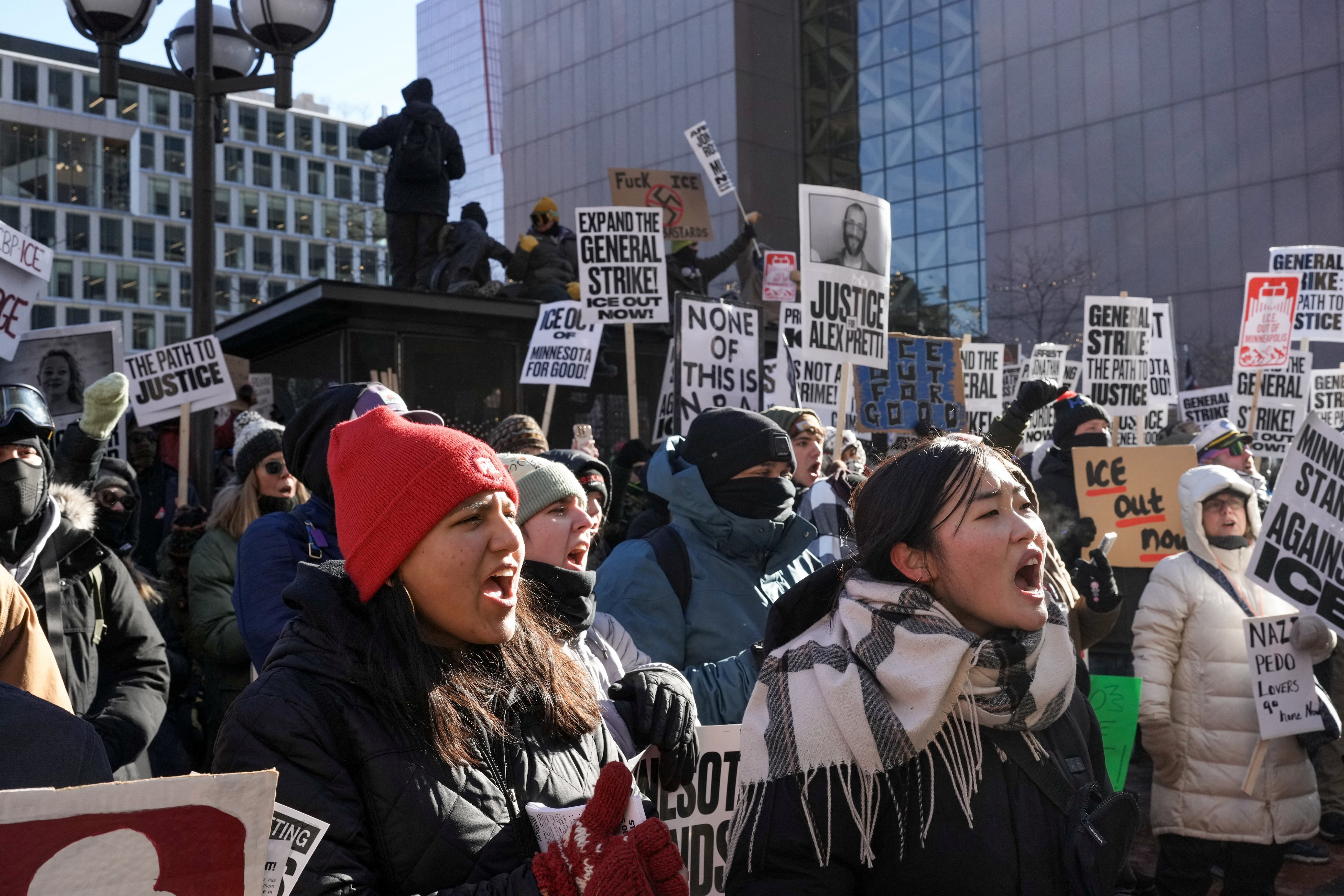 Demonstrators attend an "ICE Out" protest in Minneapolis Jan. 30, 2026, after the fatal shootings of Renee Nicole Good and Alex Pretti by U.S. federal immigration agents. Protesters held "no work, no school, no shopping" strikes across the U.S. that day to oppose the Trump administration"s immigration crackdown. (OSV News/Reuters/Tim Evans)