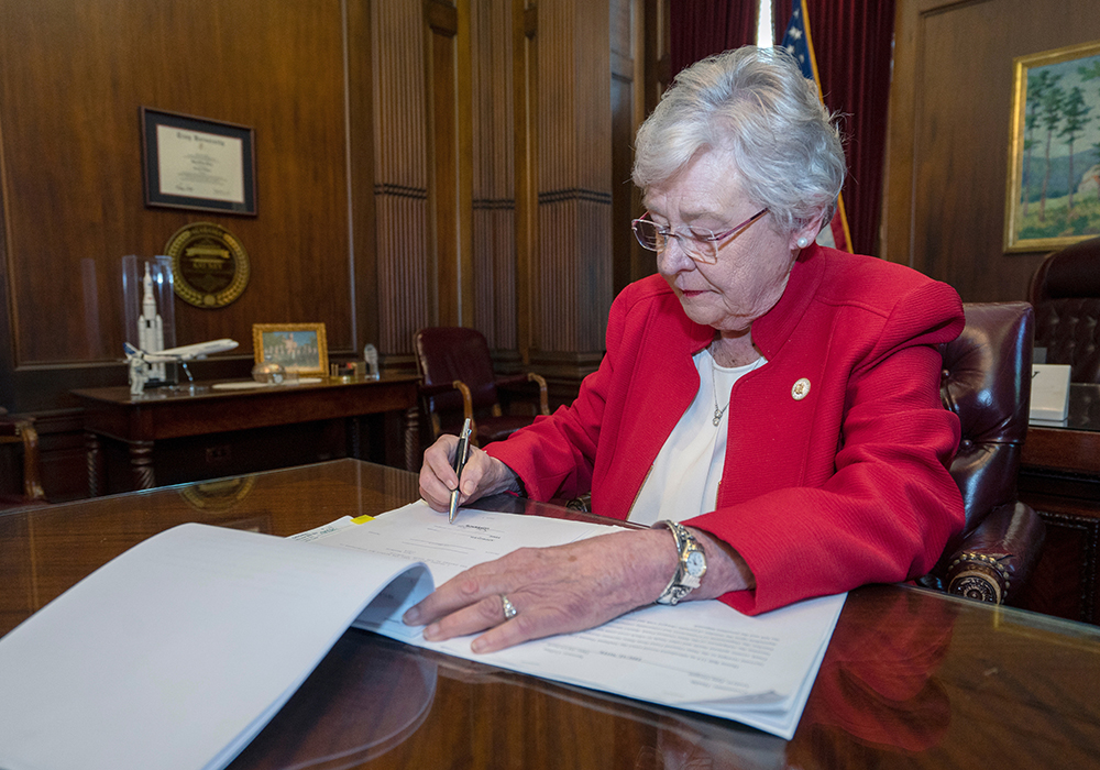 Alabama Gov. Kay Ivey is shown in 2019 signing a bill into law. (CNS photo/Office of the Governor State of Alabama handout via Reuters)