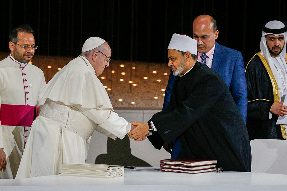 Pope Francis shakes hands with Sheikh Ahmad el-Tayeb, grand imam of Egypt's Al-Azhar mosque and university, during a document signing at an interreligious meeting in Abu Dhabi, United Arab Emirates, on Feb. 4, 2019. (CNS/Paul Haring)