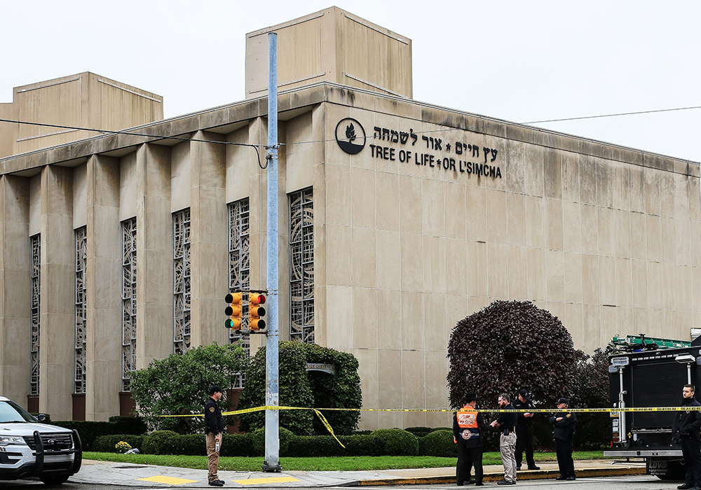 Police officers are seen after a gunman killed at least eleven people Oct. 27, 2018, at the Tree of Life Synagogue in Pittsburgh. (CNS/Reuters/John Altdorfer)