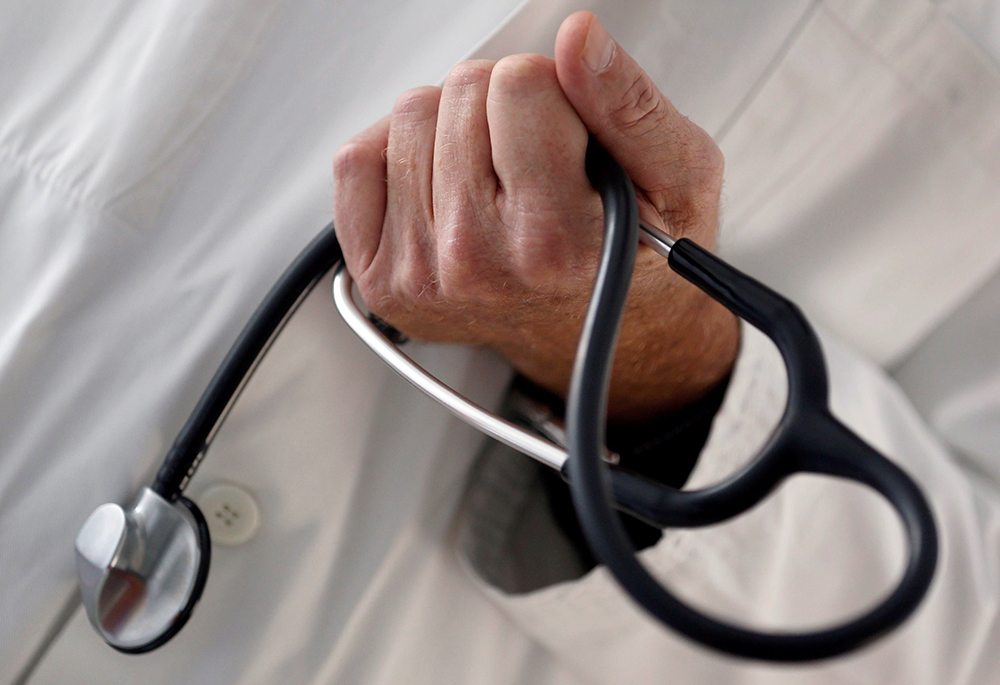 A doctor holds a stethoscope in this illustration photo. (OSV News/Reuters/Regis Duvignau)