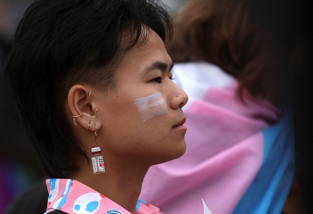 A young person listens to a speech as protesters gather after a "March for Queer and Trans Youth Autonomy" in Washington, March 31, 2023. (OSV News/Reuters/Leah Millis)
