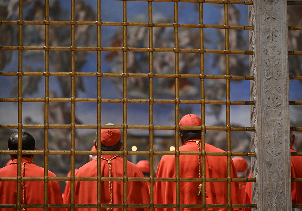 Cardinals enter the Sistine Chapel at the Vatican May 7, 2025, at the start of a conclave to elect a new pope. (CNS/Vatican Media)