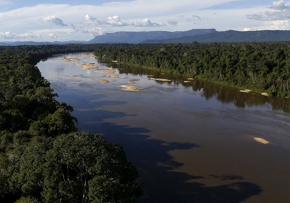 The Uraricoera River is pictured in a file photo during a Brazilian government operation against illegal gold mining on Indigenous land in the heart of the Amazon rainforest. (CNS/Reuters/Bruno Kelly)