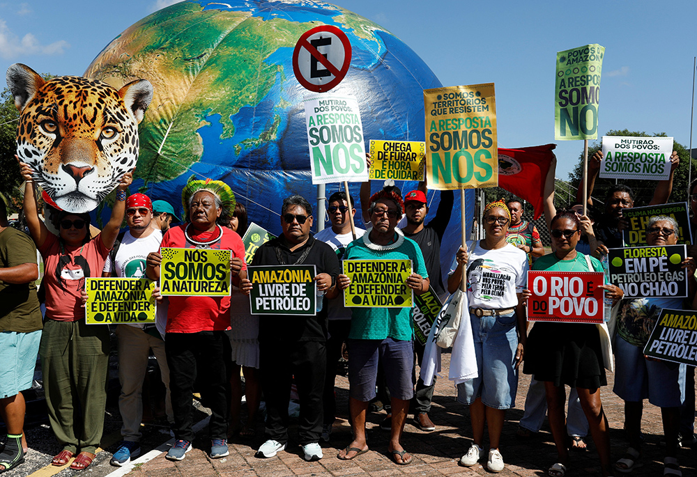 People attend a protest in Belém, Brazil, July 23, 2025, advocating for climate justice months ahead of U.N. Climate Change Conference, COP30, that Belém hosted in November. (OSV News/Reuters/Wagner Santana)