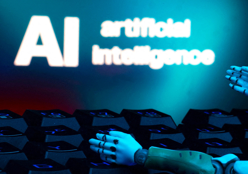 A message reading "AI artificial intelligence," a keyboard and robot hands are seen in this illustration created on Jan. 27, 2025. (OSV News/Reuters/Dado Ruvic)