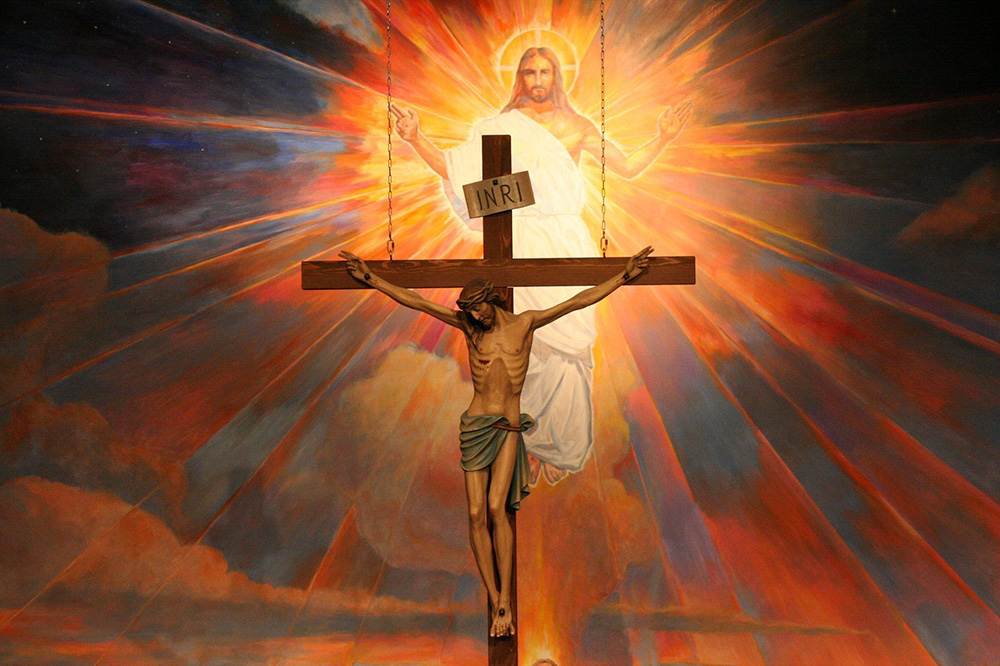 A crucifix hangs before a mural depicting the Resurrection in the sanctuary at St. Timothy Parish in Mesa, Ariz., in this undated file photo. (OSV News/Catholic Sun/J.D. Long-Garcia)