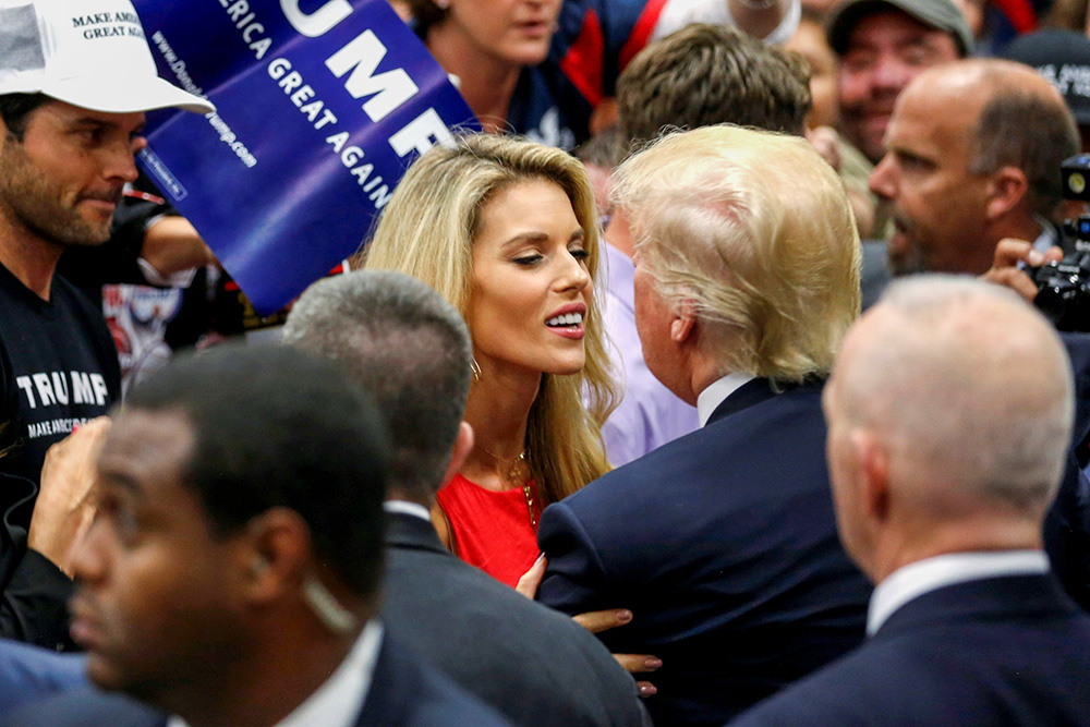 Donald Trump, at the time the Republican U.S. presidential candidate, embraces Carrie Prejean Boller, a Catholic, after a rally with supporters in San Diego May 27, 2016. (OSV News/Reuters/Jonathan Ernst)