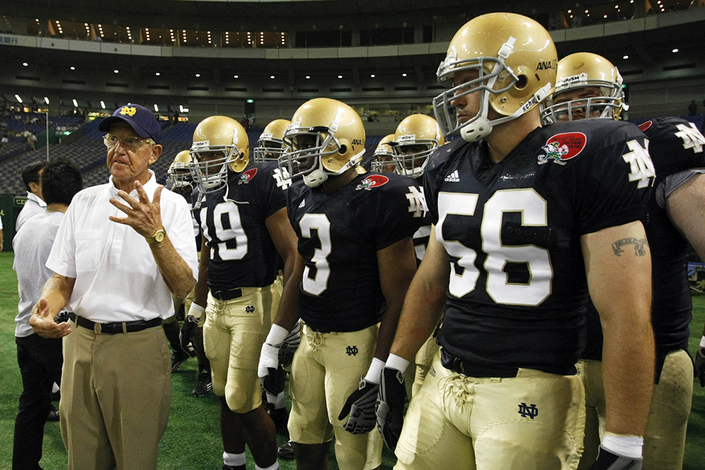 Notre Dame alumni coach Lou Holtz speaks to his team before the start of the Notre Dame Japan Bowl football game against Japan in Tokyo July 25, 2009. Holtz, a legendary college football coach and devout Catholic who led the University of Notre Dame to the 1988 National Championship, died March 4, 2026, at age 89. (OSV News/Reuters/Issei Kato)