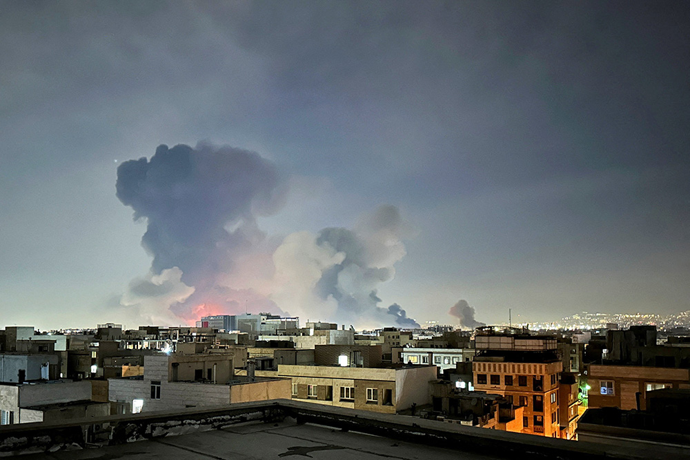 Smoke rises following an explosion in Tehran, Iran, March 7, 2026, amid the U.S.-Israel war with Iran. (OSV News/West Asia News Agency via Reuters/Naser Safarzadeh)