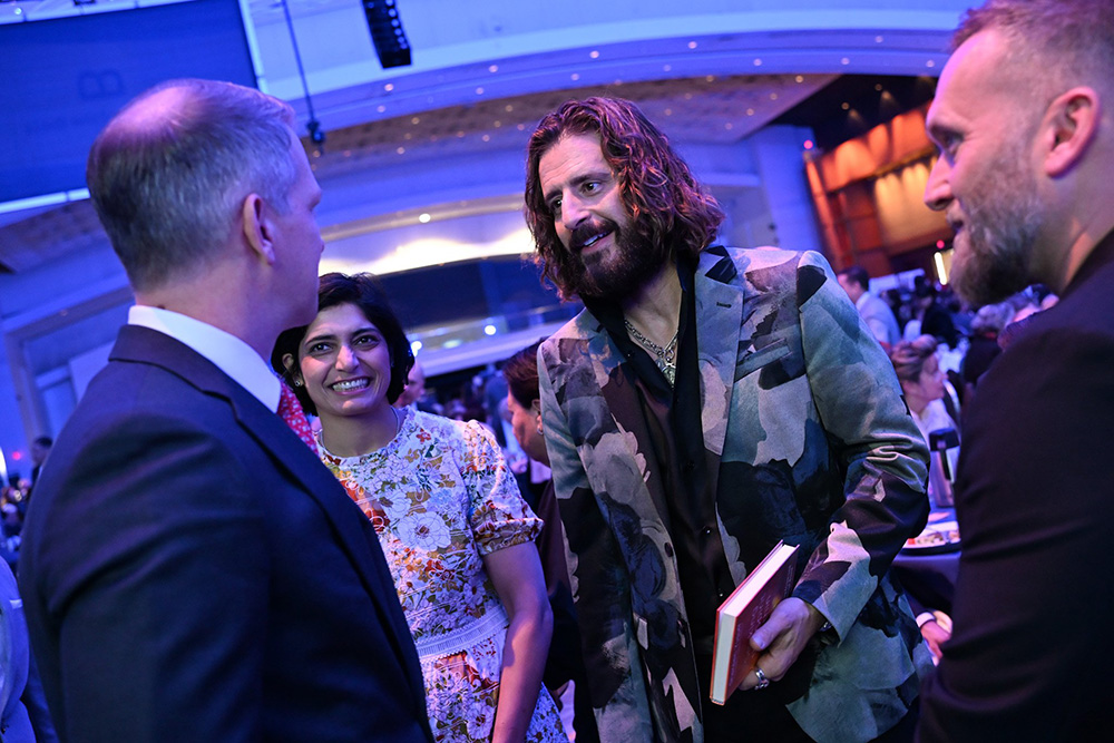 Actor Jonathan Roumie, center, best known for his TV role as Jesus Christ in "The Chosen," talks with guests during the National Catholic Prayer Breakfast in Washington March 19, 2026. (OSV News/Leslie E. Kossoff)