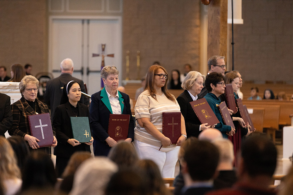 Catechists hold the Book of the Elect at the Diocese of Richmond's Rite of Election at St. Bede Catholic Church in Williamsburg, Va., Feb. 28, 2026. (OSV News/Diocese of Richmond/Vy Barto)