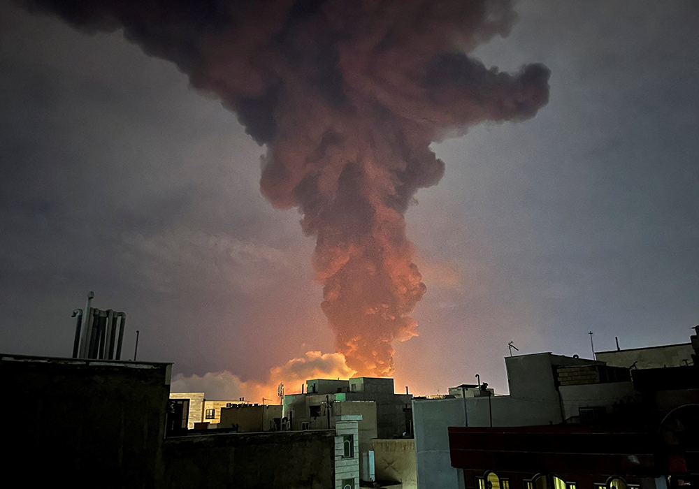 Smoke rises in Tehran, Iran, March 7, 2026, following an explosion amid the U.S.-Israeli conflict with Iran. (OSV News photo/Majid Asgaripour, West Asia News Agency via Reuters)