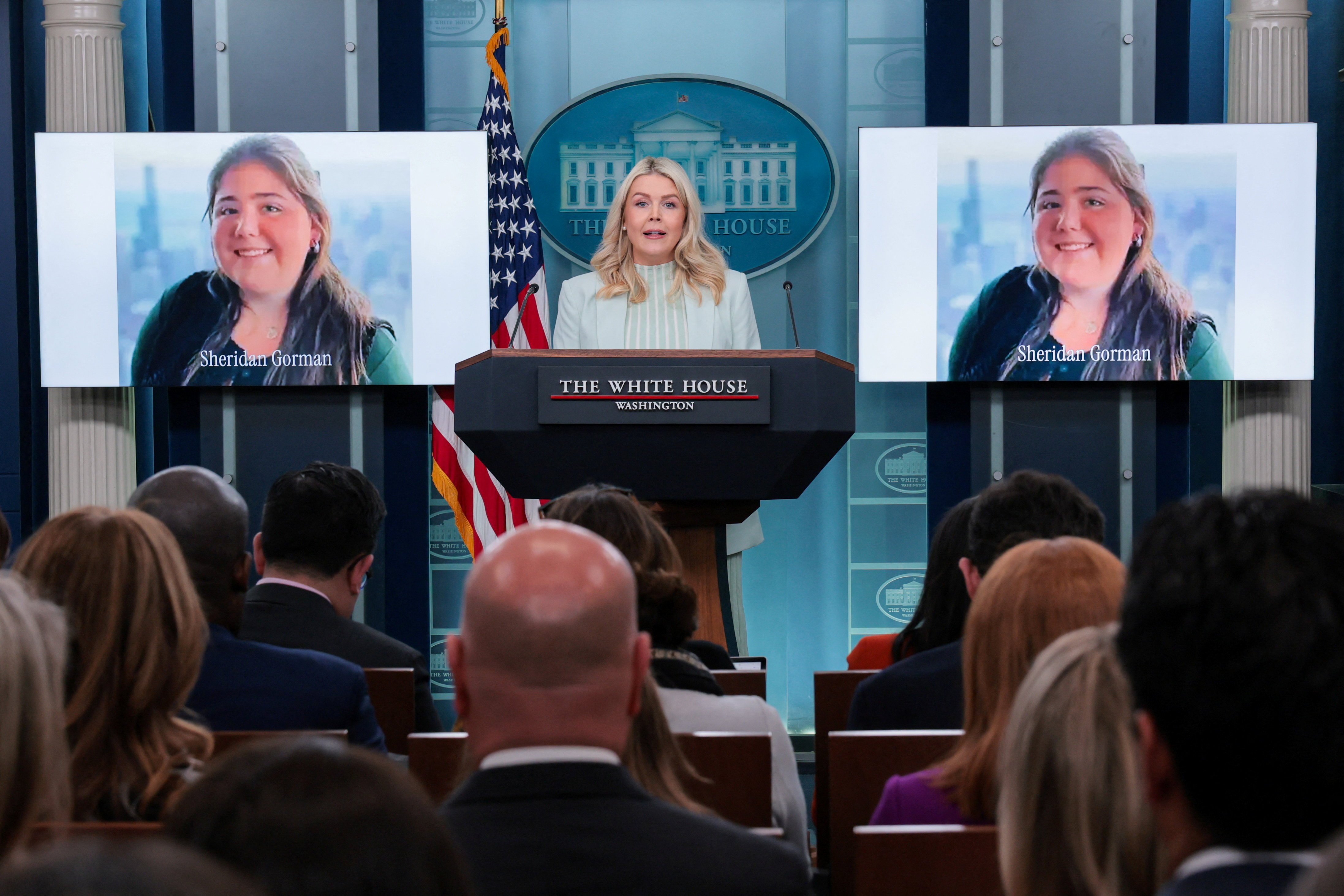 White House Press Secretary Karoline Leavitt holds a news briefing at the White House in Washington March 25, 2026, near photos of Loyola University Chicago student Sheridan Gorman. Catholics in Chicago have expressed sympathy and sorrow over the loss of Gorman, who was shot and killed March 19 near the school campus, an act of violence that also inflamed the immigration debate. (OSV News photo/Kylie Cooper, Reuters)