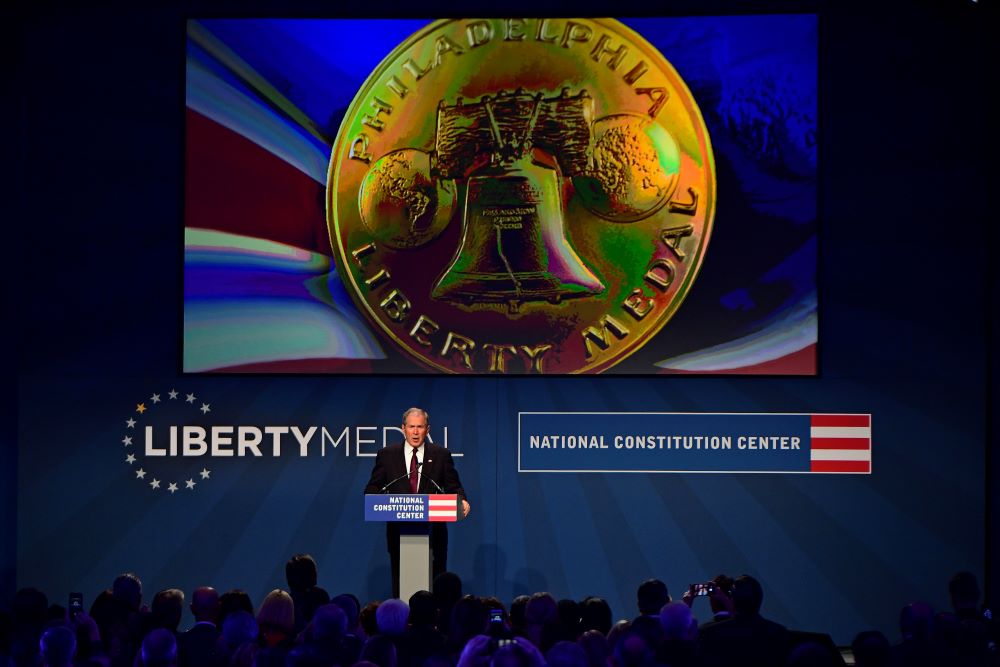 Former U.S. President George W. Bush speaks after he and his wife, First Lady Laura Bush, received the 30th annual Liberty Medal at the National Constitution Center in Philadelphia Nov. 11, 2018. (AP/Corey Perrine)