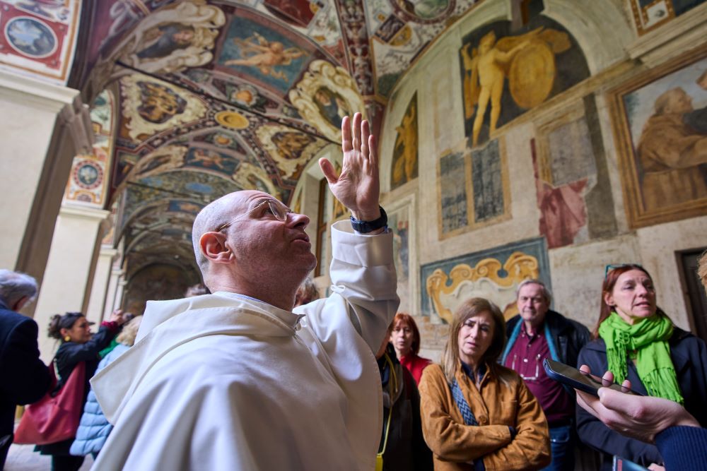 Friar Daniele Aucone, foreground, deputy director of the Basilica of Santa Maria Sopra Minerva, guides journalists through the basilica's cloister in Rome March 18, 2026. St. Catherine of Siena and the Renaissance painter Fra Angelico are buried in the basilica. (AP/Domenico Stinellis)
