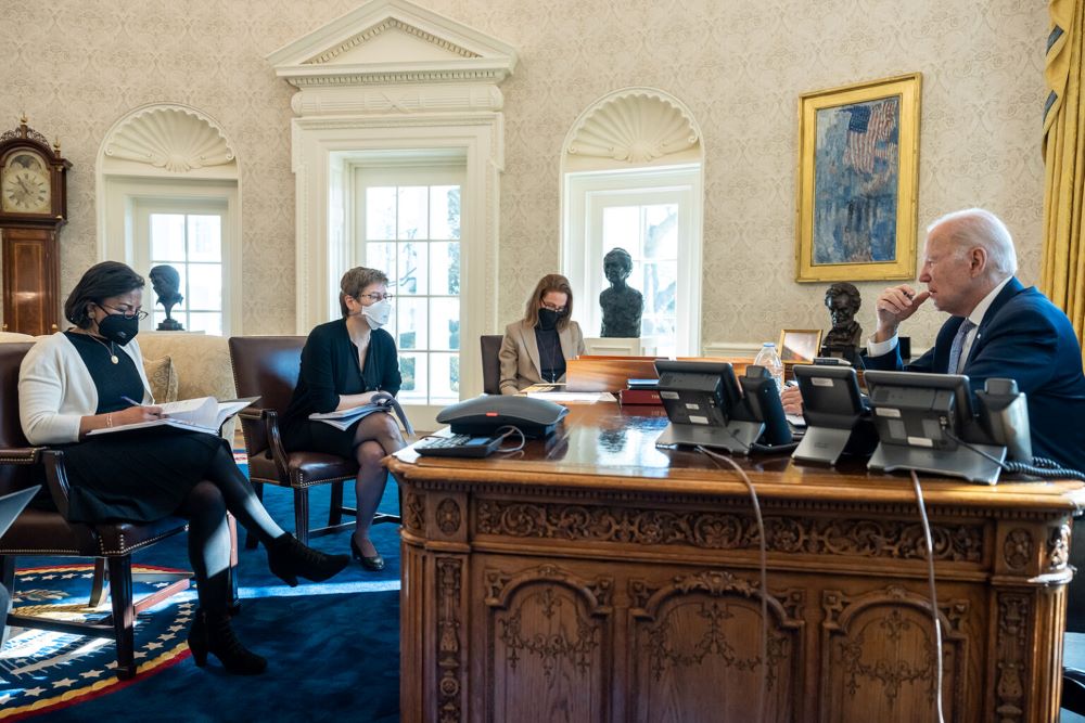 President Joe Biden meets with advisers to prepare remarks for the National Prayer Breakfast, Feb. 1, 2023, in the Oval Office of the White House. Seated clockwise from the president are Domestic Policy Council Director Susan Rice; Melissa Rogers, director of Faith-Based and Neighborhood Partnerships; and Director of Legislative Affairs Louisa Terrell. (RNS/White House/Adam Schultz)
