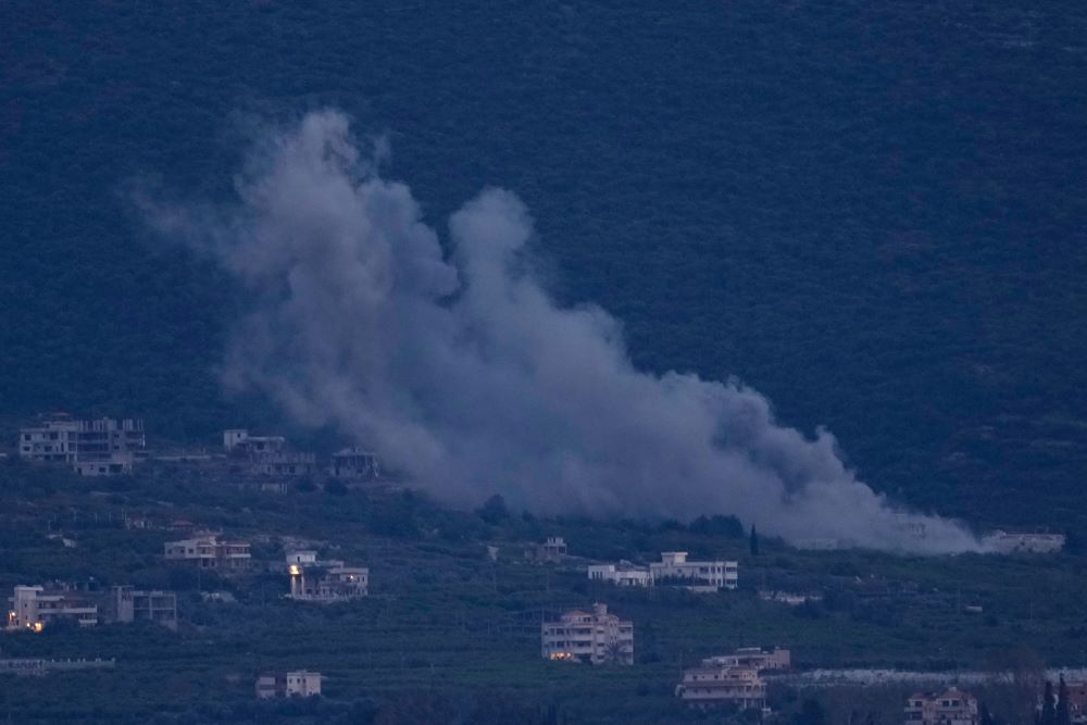 Smoke rises from an Israeli airstrike that hit Mansouri village as it is seen from Tyre city, south Lebanon March 26, 2026. (AP/Hussein Malla)