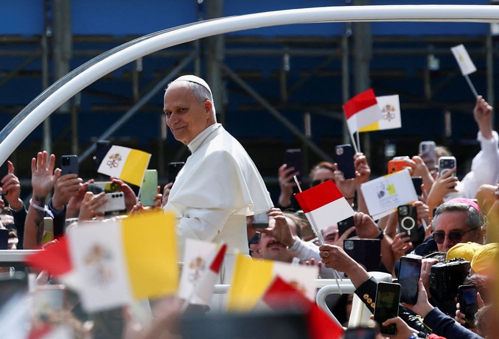 Pope Leo XIV smiles as he arrives at the church of St. Devota for a meeting with young people and catechumens, as part of a one-day trip in Monaco, March 28. It is Leo's first international journey of 2026 and only the second of his pontificate. (OSV News/Reuters/Guglielmo Mangiapane)