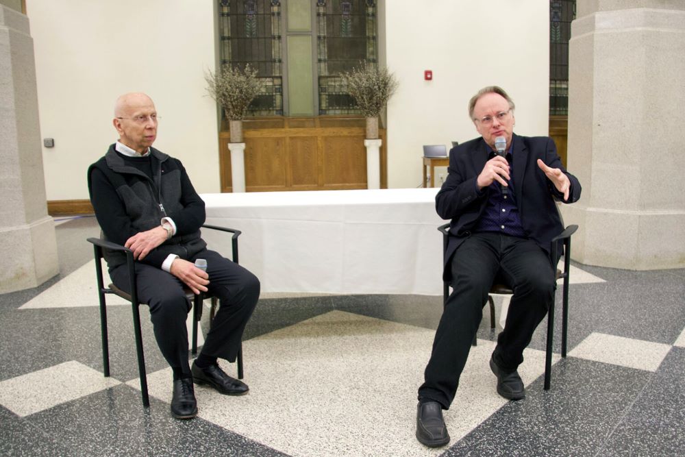 Jesuit Fr. Dennis Yesalonia, left, and director Bill McGarvey speak to attendees at a screening of the film "Communion" March 26 at St. Ignatius Loyola on Park Avenue on Manhattan's Upper East Side. Yesalonia is pastor at the church. (RNS/Fiona Murphy)