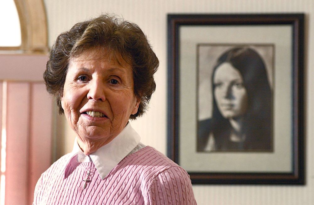 Julia Quinlan stands next to a photo of daughter Karen Ann at the Center of Hope Karen Ann Quinlan Hospice Feb. 24, 2005, in Newton, N.J. In October 1975, Julia and her husband, Joe, sought a court order to have Karen's respirator turned off so she could die naturally. On Nov. 10 of that year, the judge denied the request. The Quinlans appealed and won a reversal on March 31, 1976, and their daughter was weaned off the respirator. She died June 11, 1985. (CNS/The Beacon/Joe Gigli)