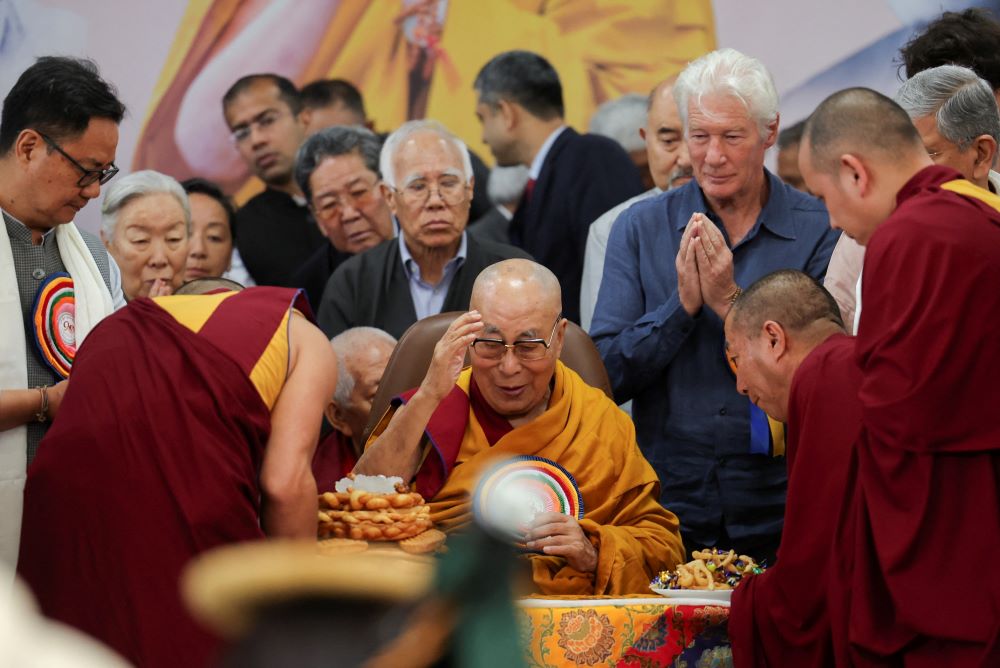 The 14th Dalai Lama, spiritual leader of Tibetan Buddhists, is served food on his 90th birthday celebration at the Dalai Lama Temple complex, in Dharamshala, India, July 6, 2025. The Dalai Lama has endorsed Pope Leo's message of peace. (OSV News/Reuters/Anushree Fadnavis)