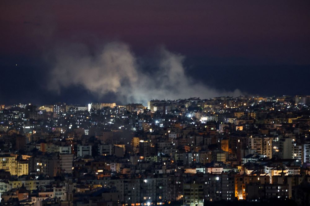 Smoke billows March 3 after an Israeli strike on Beirut's southern suburbs following an escalation between Hezbollah and Israel amid the U.S.-Israeli conflict with Iran. (OSV News/Reuters//Mohamed Azakir)