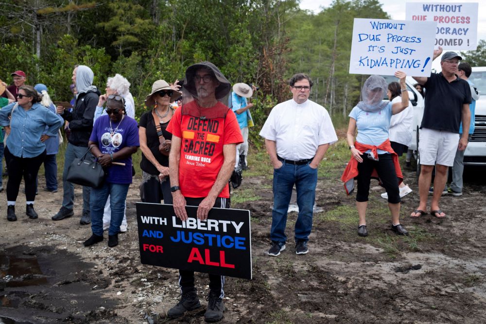 People attend a vigil in support of immigration detainees at the entrance of "Alligator Alcatraz" ICE, a detention center at the Dade-Collier Training and Transition Airport in Ochopee, Fla., Aug. 10, 2025. (OSV News/Reuters/Marco Bello)