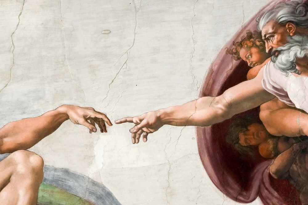 A detail from Michelangelo's "The Creation of Adam" is seen on the ceiling of the Sistine Chapel at the Vatican Feb. 28. (CNS/Lola Gomez)