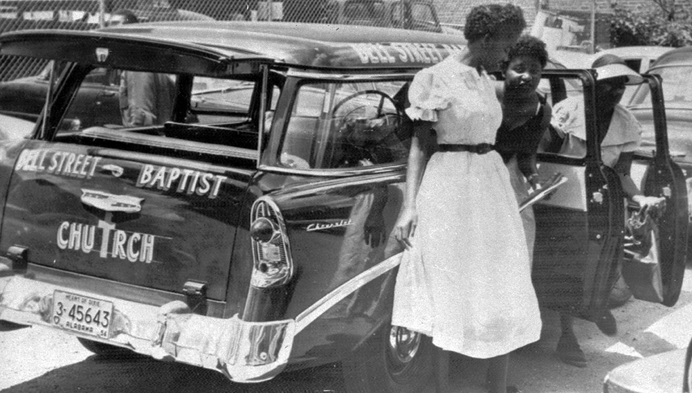 Women alight from a church-operated station wagon May 31, 1956, in Montgomery, Ala. The vehicle was used to provide transportation for African Americans boycotting segregated city buses. (AP)