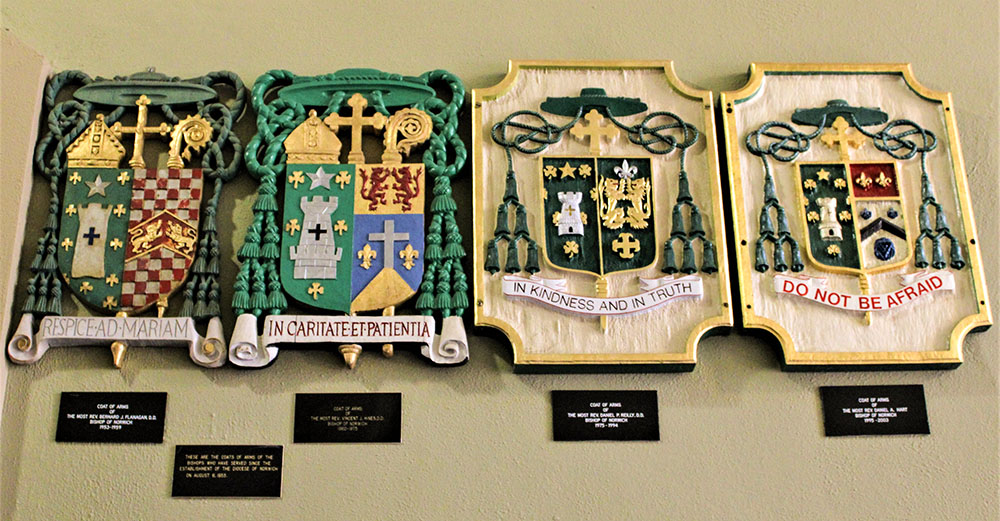 Episcopal coats of arms hang in the Cathedral of St. Patrick in Norwich, Conn. (Wikimedia Commons/Farragutful)