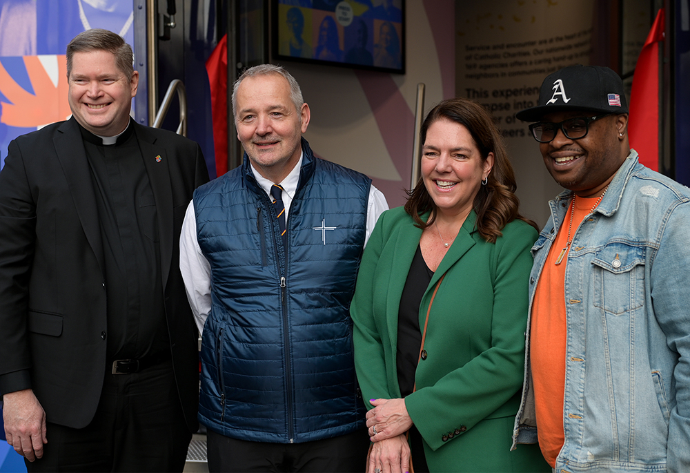 At the ribbon cutting for the launch of the People of Hope Museum in lower Manhattan, March 26, 2026, CCUSA President and CEO Kerry Alys Robinson was joined by, from left, the Very Rev. Patrick J. Keating, deputy CEO of Catholic Charities Brooklyn & Queens; J. Antonio Fernández, CEO of Catholic Charities Archdiocese of New York; and Jamar Carr, a substance abuse counselor at Catholic Charities Brooklyn & Queens. Carr's video testimonial of service to a resilient client is one of 42 featured in the museum. 