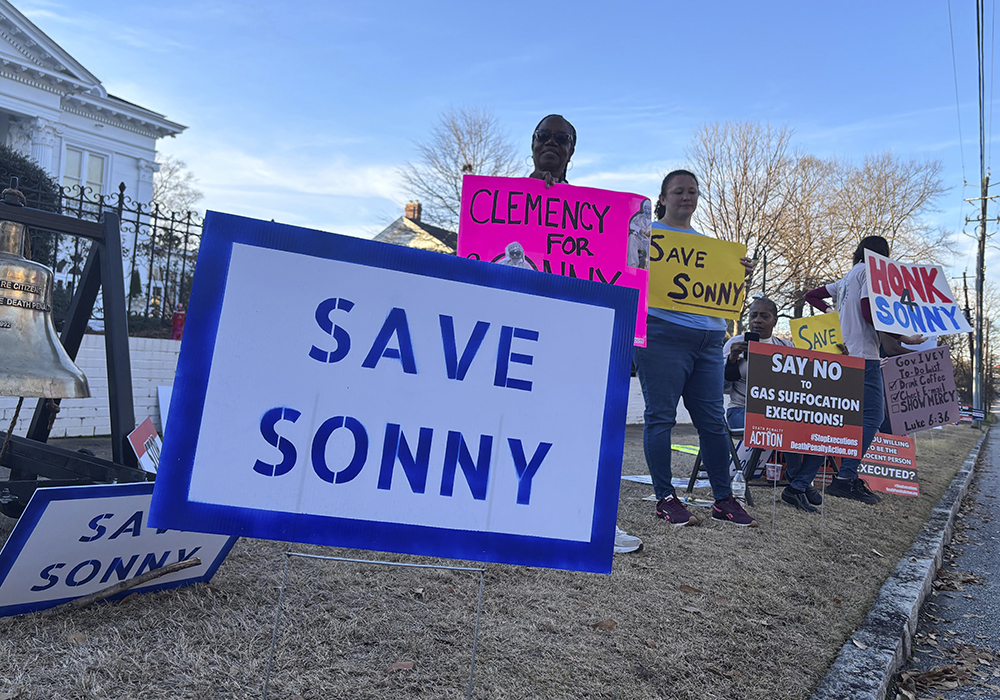 People gather outside the Alabama Governor's Mansion in Montgomery, Alabama, on Feb. 16, 2026, to urge Gov. Kay Ivey to grant clemency to Sonny Burton, who is scheduled to be executed on March 12, 2026. (AP photo/Kim Chandler)