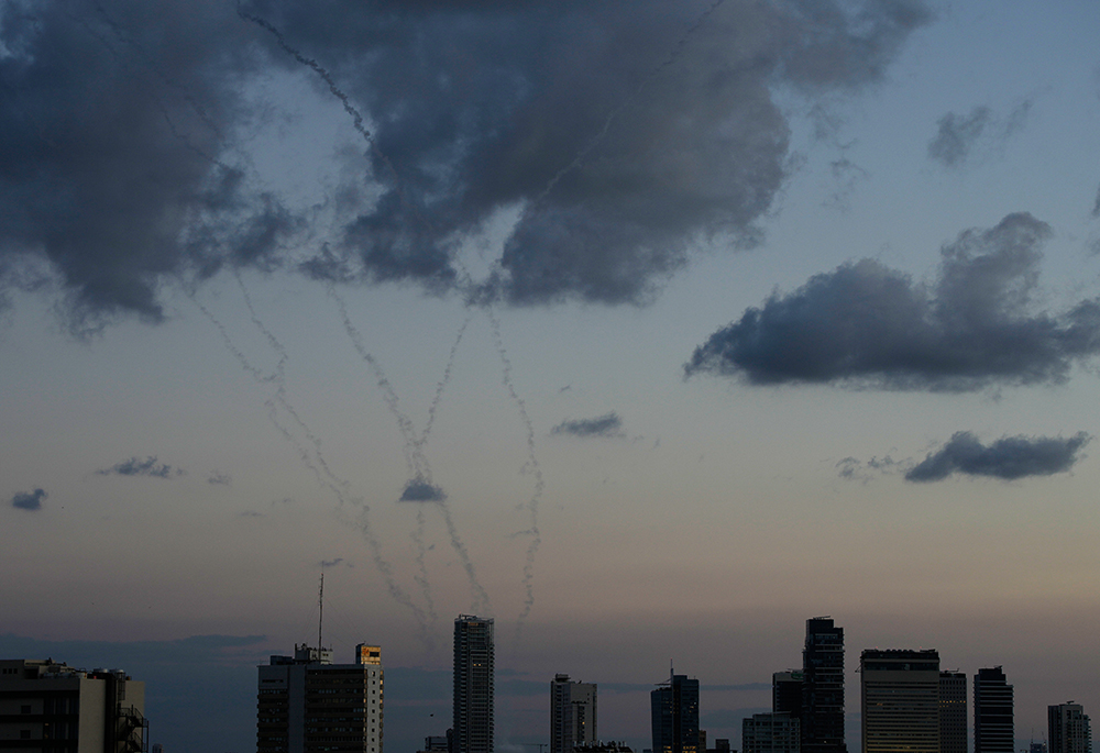 Traces of an air defense missile interception is seen over Tel Aviv, Israel, Saturday, Feb. 28, 2026. (AP photo/Ohad Zwigenberg)