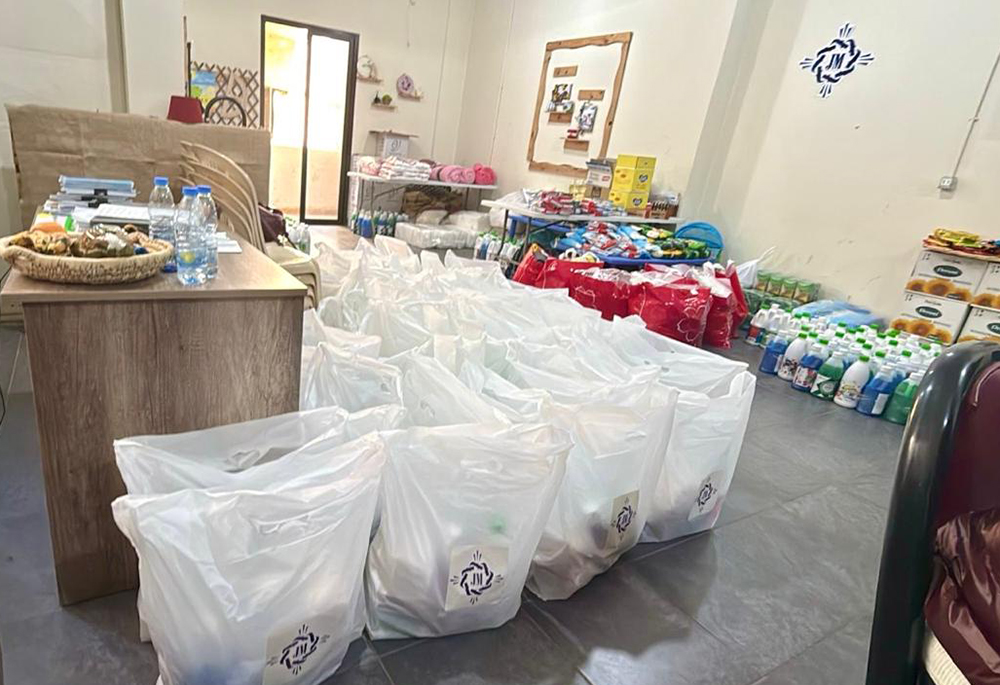 Supplies of water, food, medicine and basic necessities piled up at the aid office of the Sisters of Jesus and Mary in Beirut, waiting to be distributed to hundreds of displaced Lebanese who evacuated from southern towns on the border with Israel, in March 2026. (Courtesy of Rima Abi Karam)
