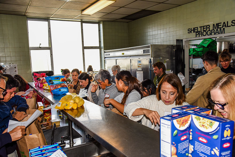 Parishioners of St. Ignatius Parish in San Francisco assemble Thanksgiving baskets on Sunday, November 16, 2025, for Catholic Charities to share with local families in need. (Courtesy of Nano Visser)