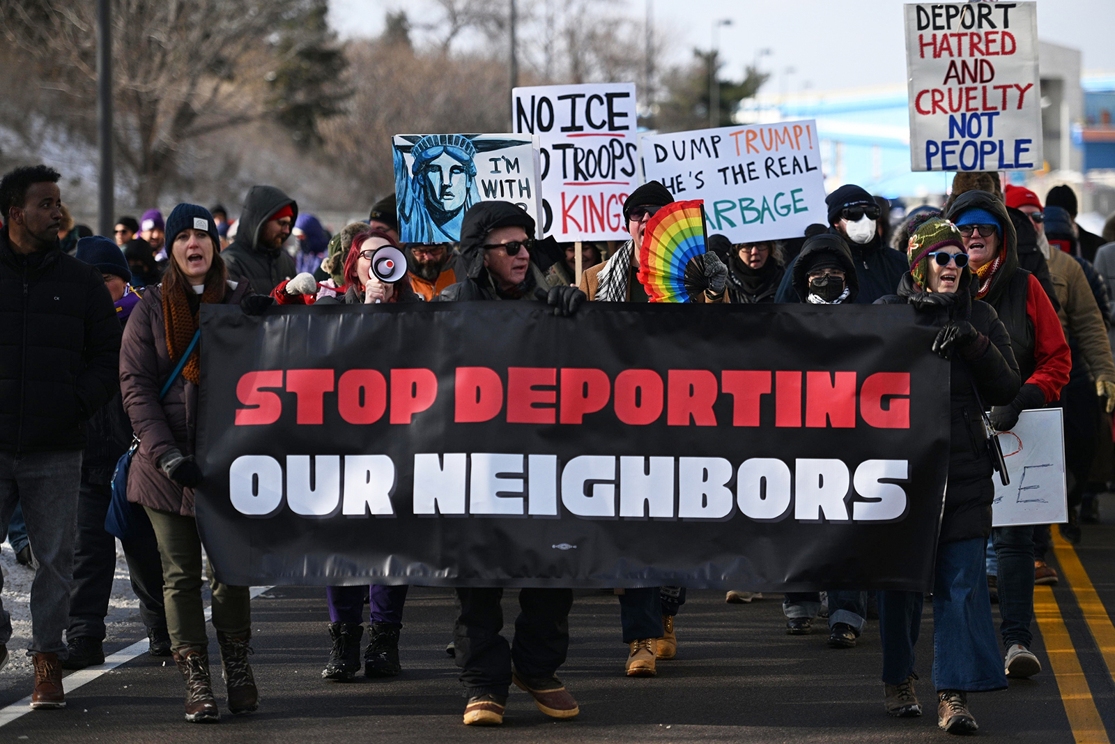 Protesters gather at a rally for immigrants and workers outside Signature Aviation near the Minneapolis-St.Paul International Airport, Dec 3, 2025, in Minneapolis. (AP Photo/Tom Baker)