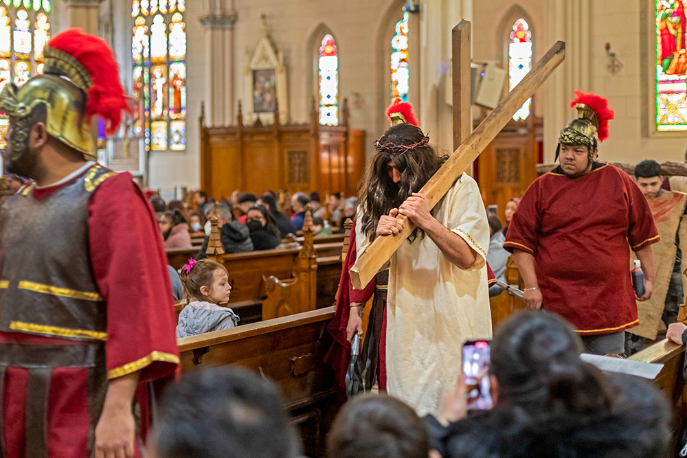 Parishioners at the Basilica of Ste. Anne de Détroit participate in a Good Friday reenactment of the Stations of the Cross in Detroit April 15, 2022. (CNS/Jim West)