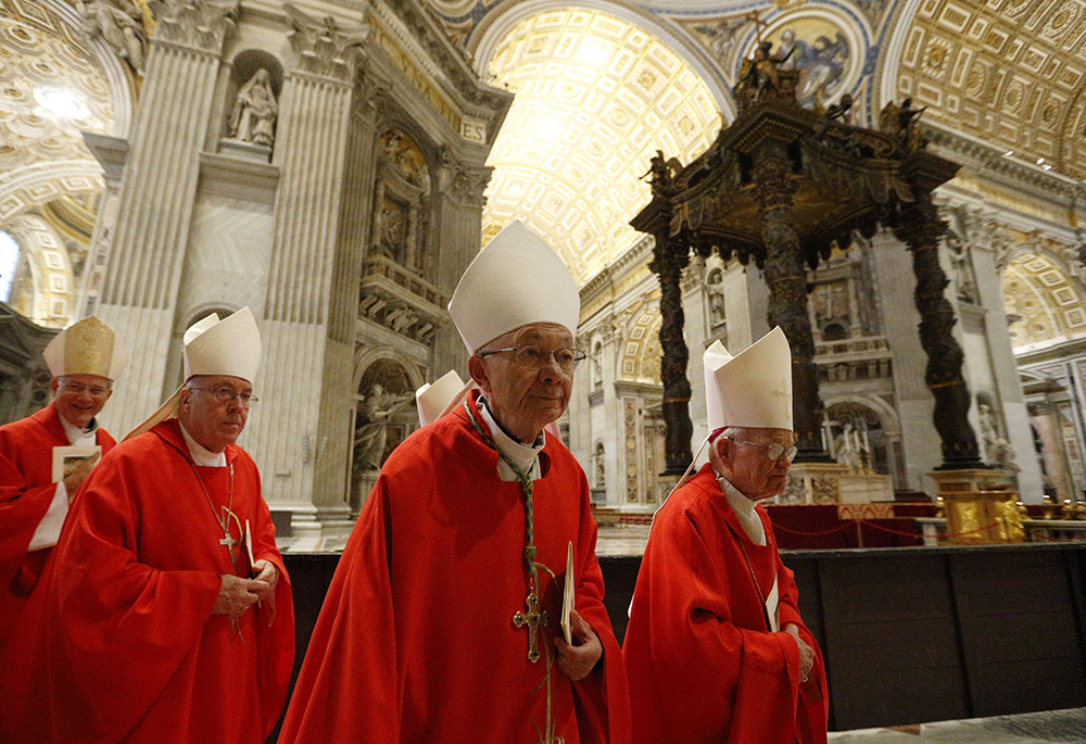 Bishop J. Douglas Deshotel of Lafayette, Louisiana, retired Archbishop Alfred C. Hughes of New Orleans and other U.S. bishops arrive to concelebrate Mass in the crypt of St. Peter's Basilica at the Vatican Dec. 5, 2019. (CNS/Paul Haring)